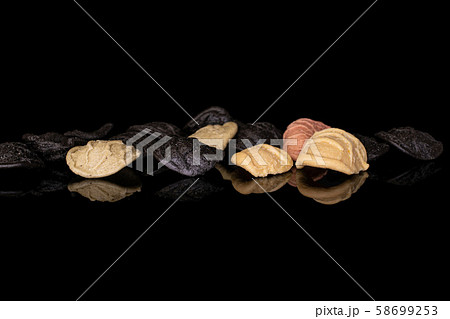 Pasta orecchiette isolated on black glass 58699253