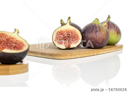 Sweet purple fig isolated on white Sweet purple fig isolated on white 58700026