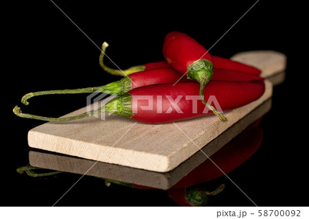 Red hot cayenne chili isolated on black glass 58700092