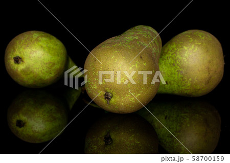 Fresh green pear isolated on black glass 58700159