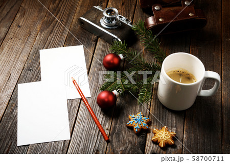 Photos, camera, pine tree branch and cup of coffee 58700711