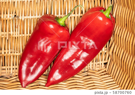 Sweet red bell pepper with braided rattan 58700760