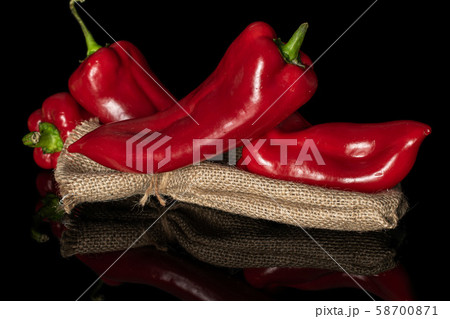 Sweet red bell pepper isolated on black glass 58700871