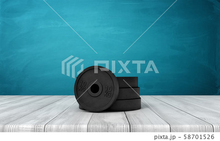 3d rendering of black weight plates on white wooden floor and dark turquoise background 58701526