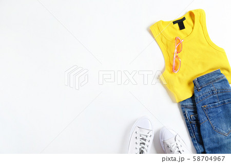 Fashionable clothing set lying on white Fashionable clothing set lying on white 58704967