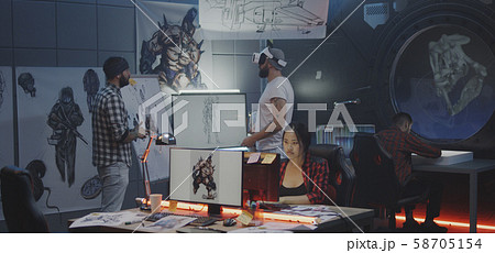 Video game developers brainstorming Video game developers brainstorming 58705154