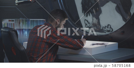 Graphic designer drawing video game art 58705168
