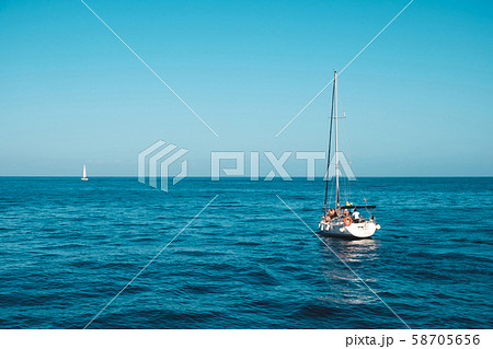 sailing boat with group of people on calm ocean on sailing boat with group of people on calm ocean on 58705656