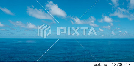blue sky with clouds over water - ocean horizon , blue sky with clouds over water - ocean horizon , 58706213