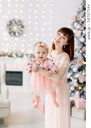 happy family mother and baby little daughter playing in the winter for the Christmas holidays 58707544