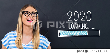 Loading new year 2020 with happy young woman 58711054