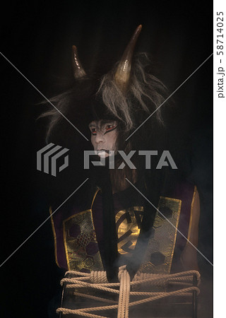 Gloomy demon portrait. Drummer actor in a wig with 58714025
