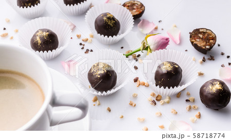 Food banner. White ceramic cup of coffee and chocolate candies Food banner. White ceramic cup of coffee and chocolate candies 58718774