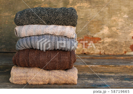 Pile of colorful warm clothes on wooden Pile of colorful warm clothes on wooden 58719665
