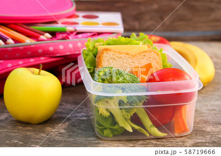 Sandwiches, fruits and vegetables in food box, Sandwiches, fruits and vegetables in food box, 58719666