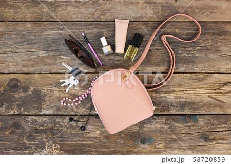 Things from open lady purse. Cosmetics and women's 58720859