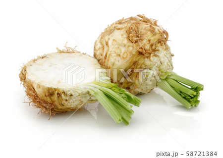 Fresh celeriac root with slice isolated 58721384