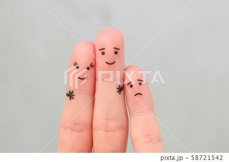 Fingers art of happy couple. Man kisses woman on 58721542