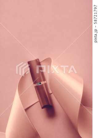 Luxury lipstick and silk ribbon on blush pink 58721797