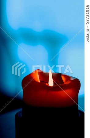 Red holiday candle on dark background, luxury 58721916