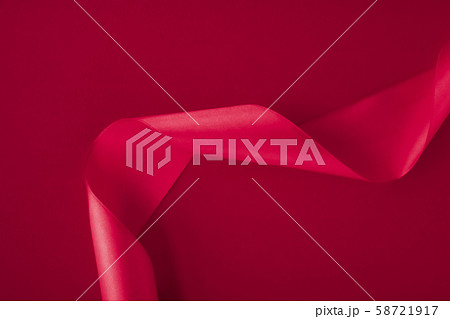 Abstract curly silk ribbon on pink background, 58721917