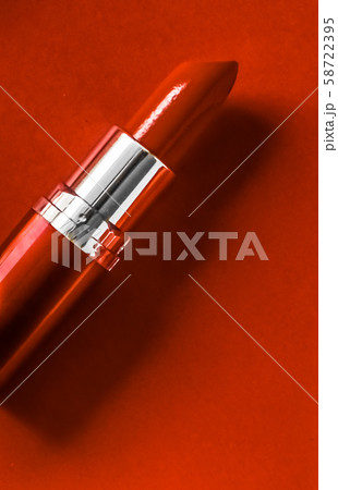 Luxury lipstick and silk ribbon on orange holiday 58722395