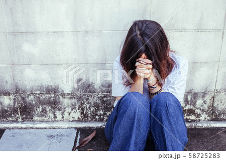 Young Asian girl sitting on the stressed and 58725283