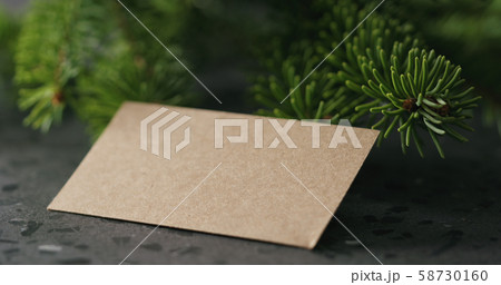 spruce twig with empty card on terrazzo countertop spruce twig with empty card on terrazzo countertop 58730160