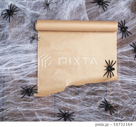 roll of untwisted brown paper on a white web and roll of untwisted brown paper on a white web and 58732164
