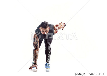 One caucasian man young sprinter runner running in silhouette studio on white background. One caucasian man young sprinter runner running in silhouette studio on white background. 58733104