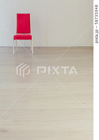 pink chair in the interior of an empty white room 58735048