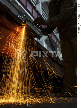 Industrial Worker at the factory welding closeup sparks light long exposure 58735614