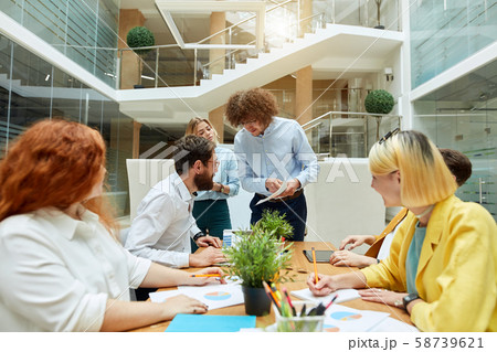 Hard working team of designers in the office Hard working team of designers in the office 58739621