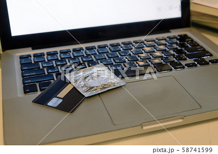 condom on laptop 58741599