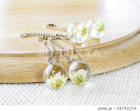 Dried flower in crystal clear resin pendant Dried flower in crystal clear resin pendant 58742254