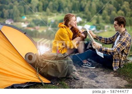 young man and woman preparing for travel 58744477