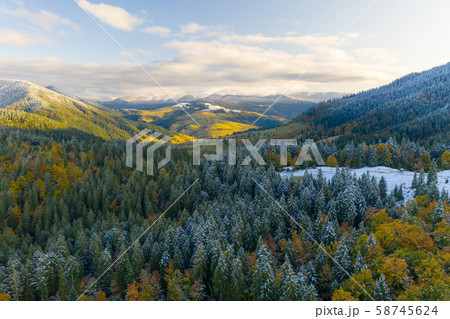 AERIAL: Flight Over Foggy Autumn Colourful Forests. AERIAL: Flight Over Foggy Autumn Colourful Forests. 58745624