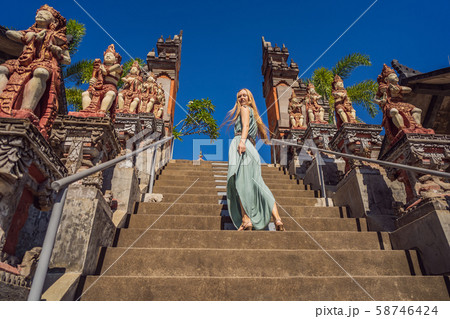 Young woman tourist in budhist temple Brahma Vihara Arama Bali Young woman tourist in budhist temple Brahma Vihara Arama Bali 58746424