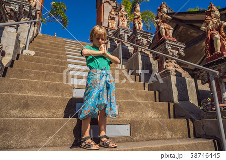 Young boy tourist in budhist temple Brahma Vihara Arama Bali Young boy tourist in budhist temple Brahma Vihara Arama Bali 58746445
