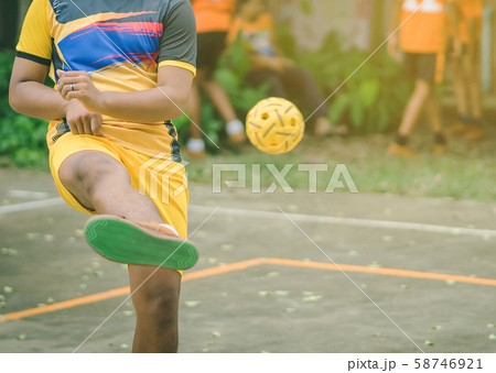 Students playing traditional asian sport game sepak takraw in school Students playing traditional asian sport game sepak takraw in school 58746921