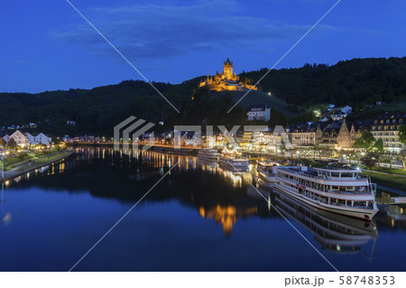 Town and Cochem Imperial Castle by river at sunset in Cochem, Germany 58748353