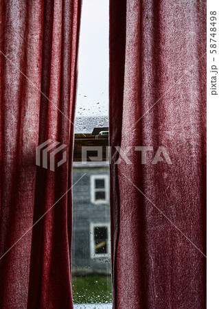 Red curtains over window Red curtains over window 58748498