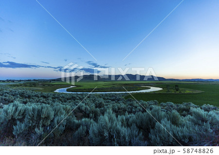 River in field at sunset in Picabo, Idaho, USA 58748826