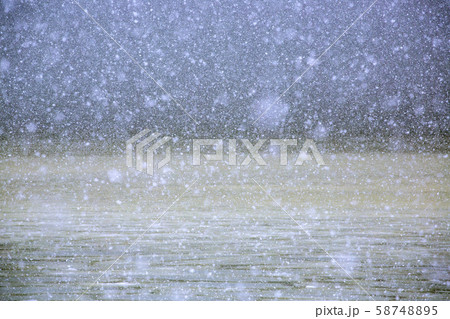 Snow over lake 58748895