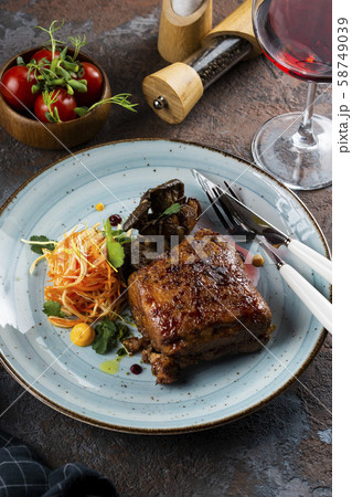 Grilled meat with salad by glass of red wine Grilled meat with salad by glass of red wine 58749039