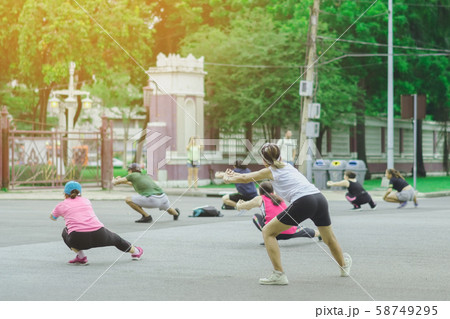 Group of elderly friend doing aerobic dance after work   together at Lumpini Park in Bangkok, Thailand. 58749295