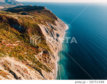 Aerial view of rocky cliff, coastline and sea with waves in Anapa Aerial view of rocky cliff, coastline and sea with waves in Anapa 58751496
