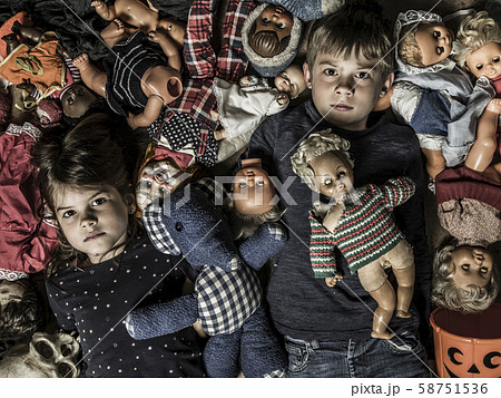 Creepy children with scary dolls 58751536