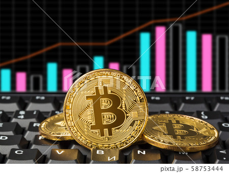 Bitcoins on computer and diagram - business Bitcoins on computer and diagram - business 58753444