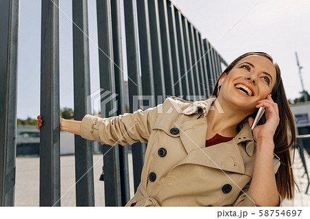Joyful brunette female smiling while being in all ears 58754697